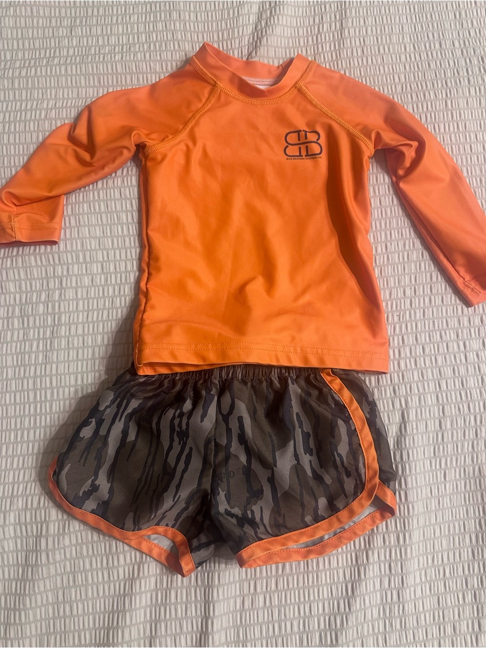 Kids Orange Rash Guard Top and Camo Swim Trunks Set